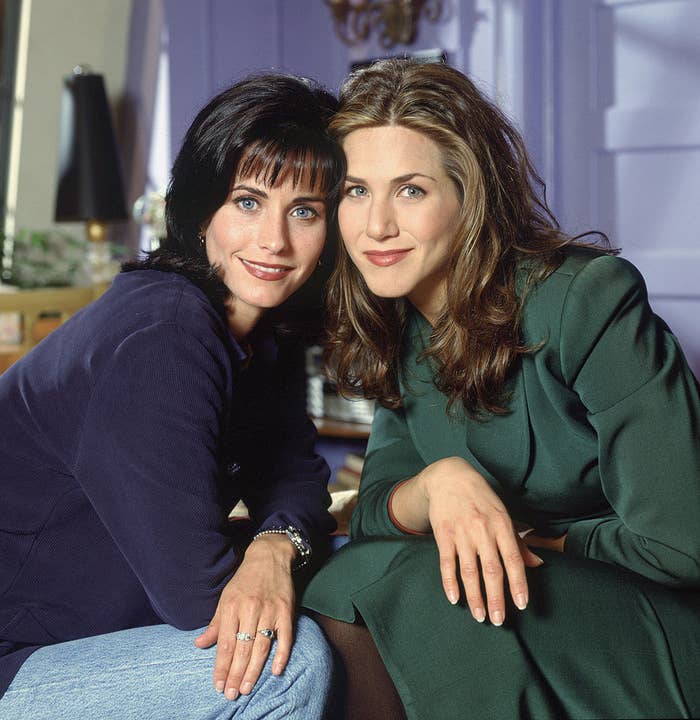 Courteney Cox and Jennifer Aniston posing as Monica and Rachel on the set of &quot;Friends&quot;