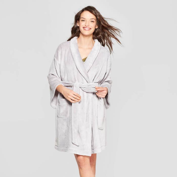 A model wearing a grey robe