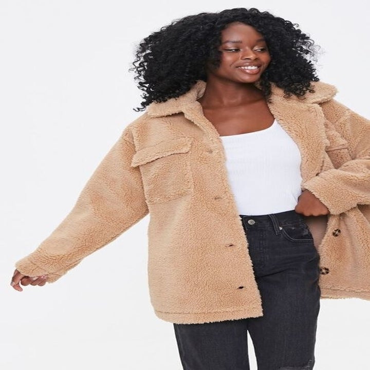 model wearing the taupe shearling jacket 