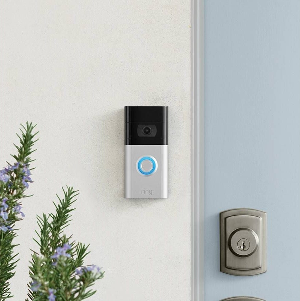 ring video doorbell on the wall next to a front door