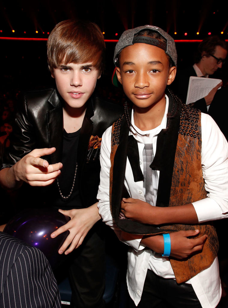 A very young Justin Bieber and Jaden Smith posing together at the American Music Awards in 2010