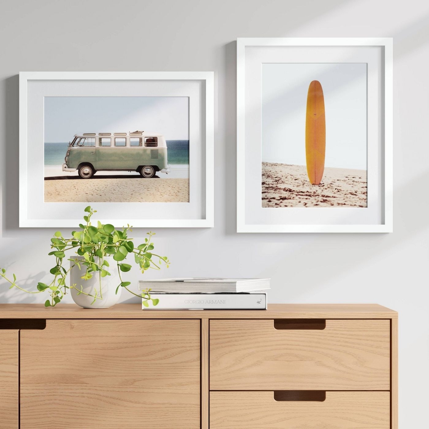 a framed photograph of a van on the left and a framed photograph of a yellow surfboard on the right