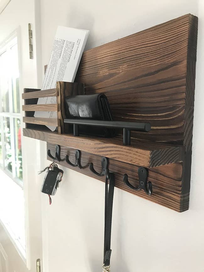 reviewer image of the Ripple Creek Key Holder and Mail Shelf mounted on an entryway wall