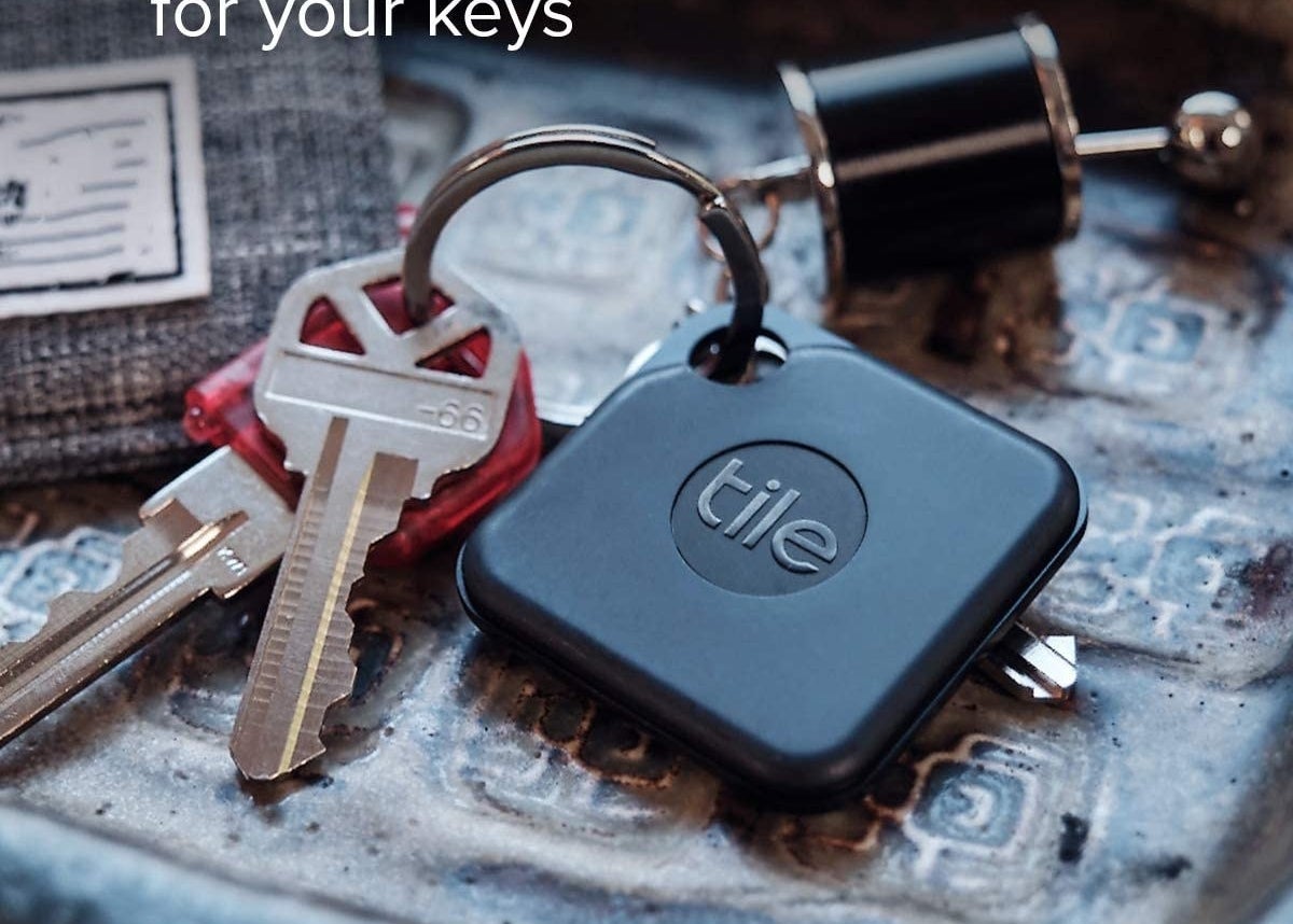 A tile pro on a keychain with keys 