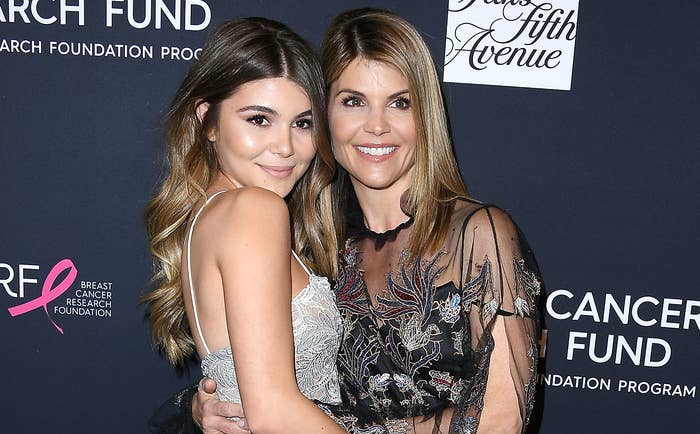 Lori poses with Olivia at an event