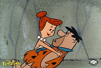 Wilma kissing Fred Flintstone.