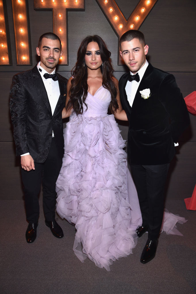 Joe Jonas, Demi Lovato, and Nick Jonas at the Vanity Fair Oscar Party in 2017