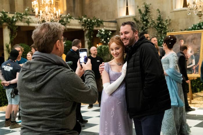 Chris Van Dusen taking a photo with Phoebe Dynevor behind the scenes