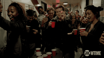 People playing beer pong at a house party