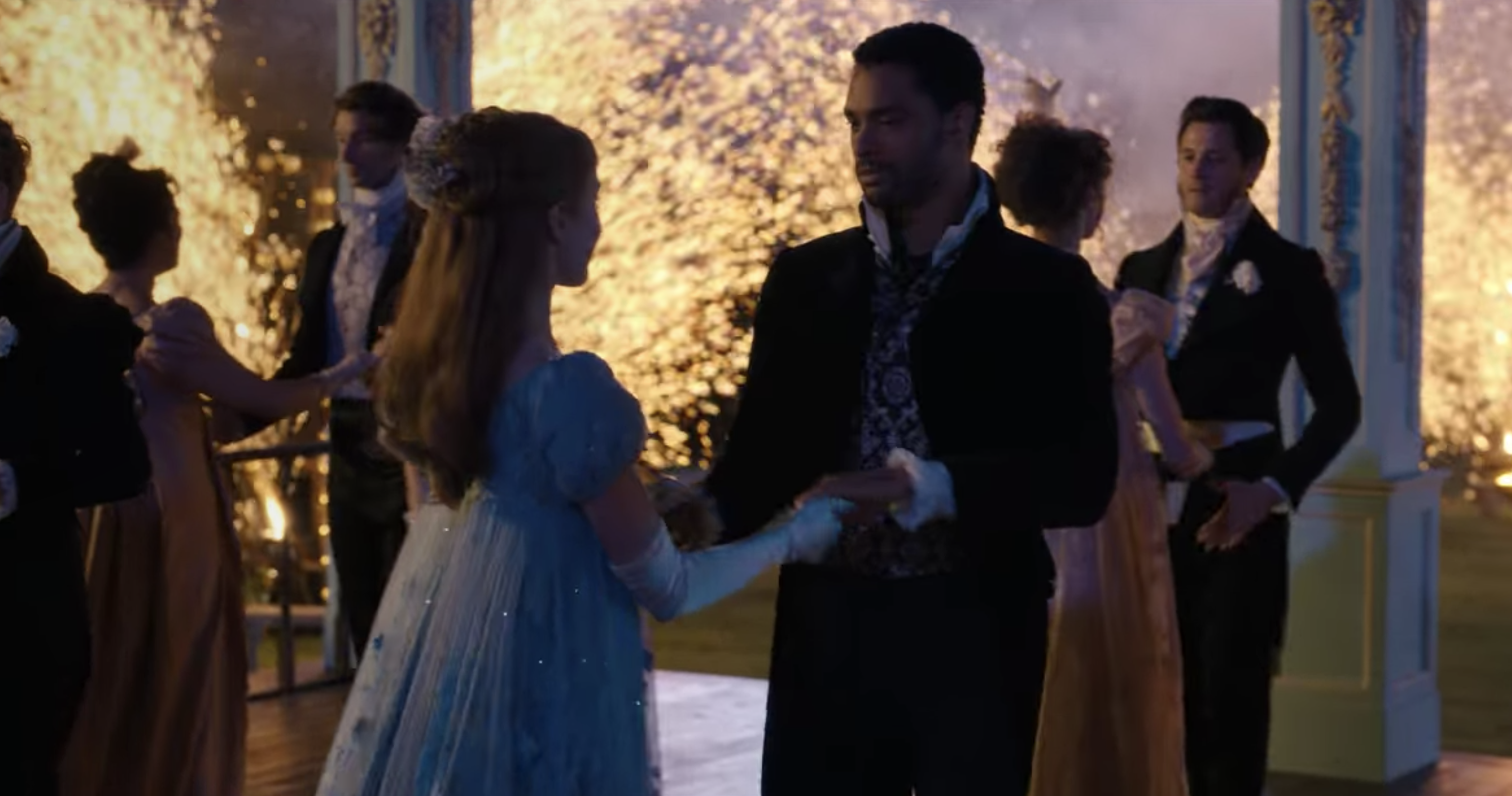 Simon and Daphne dancing with fireworks in the background