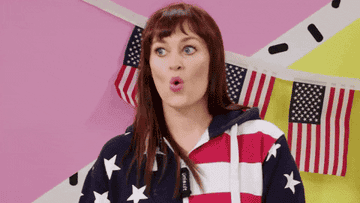 A girl in an American flag sweatshirt making a &quot;yikes&quot; face