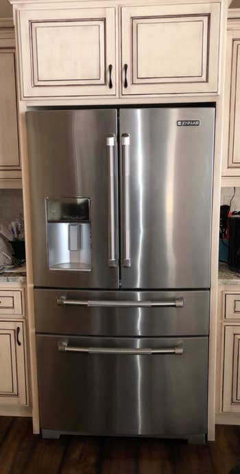 A reviewer's spotless stainless steel fridge after using the wipes