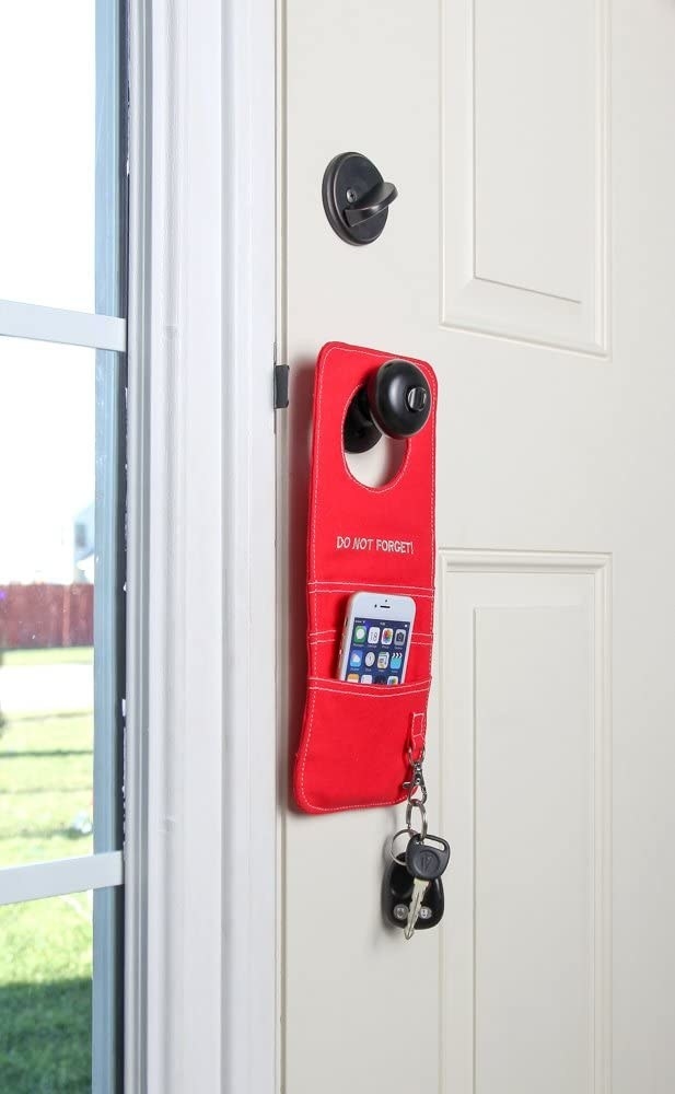 Door knob organizer hanging on front door