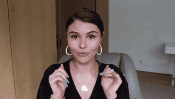 Olivia talks to fans in a gif from her YouTube 
