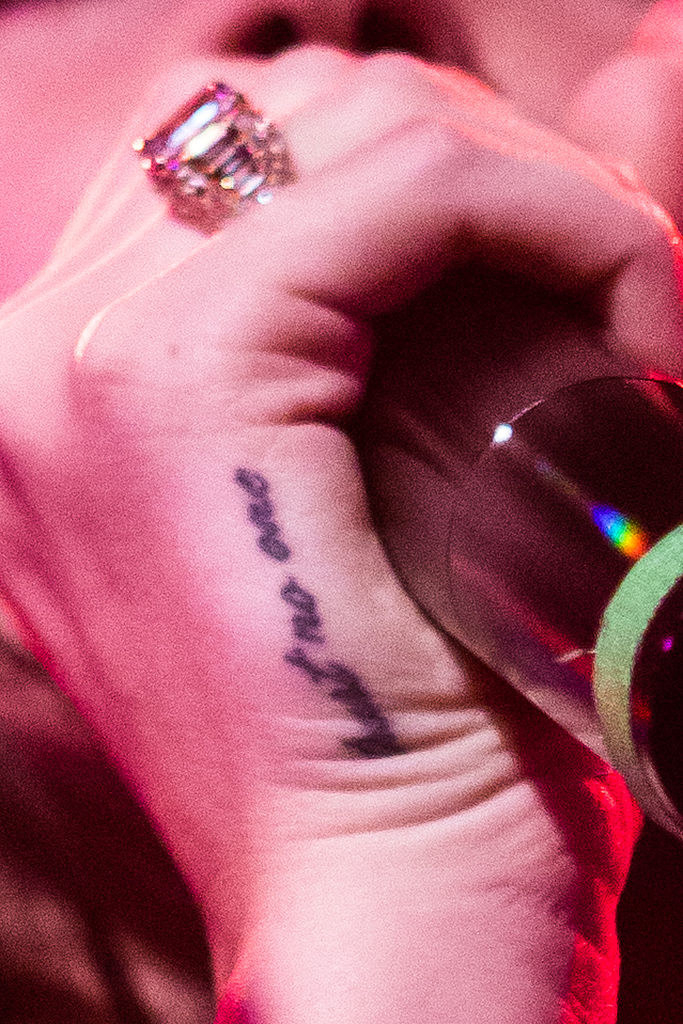 The tat in script on the side of her hand
