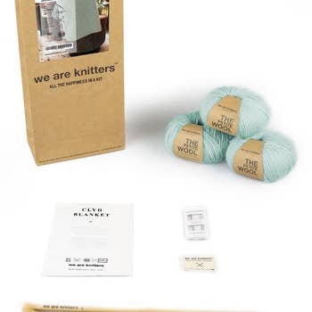 the knitting set with yarn, needles, and instructions
