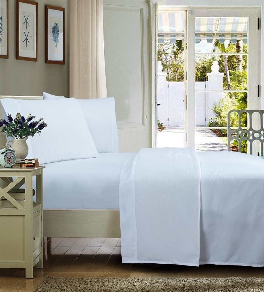a white set of wrinkle-free sheets on a bed