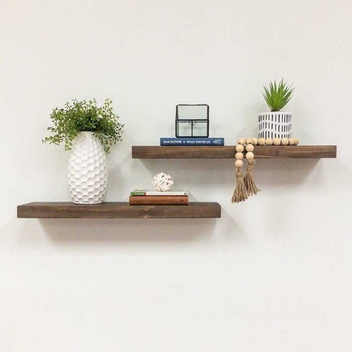 Floating shelves with home decor on them.