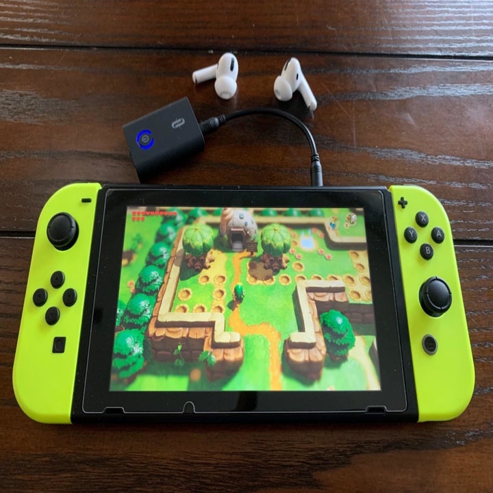 Amazon reviewer photo of Bluetooth transmitter connected to Nintendo Switch