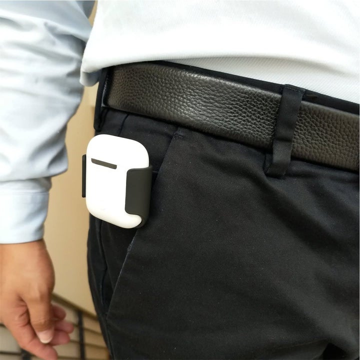 Model wearing AirPods belt holder attached to their pocket