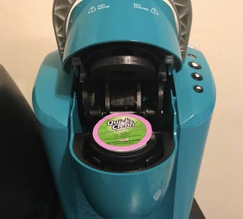 reviewer photo of cleaning K-cup placed inside Keurig