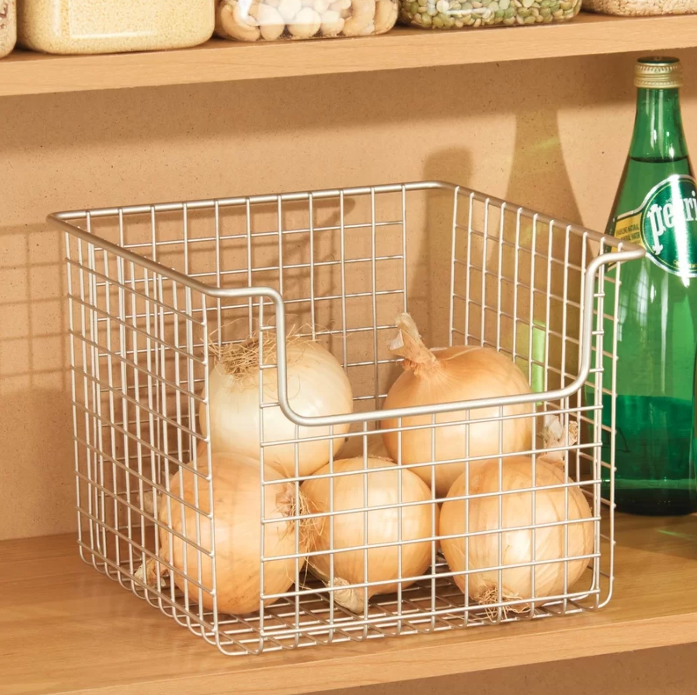 The wire basket holding onions
