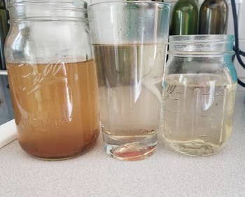 three cups of dirty water that get progressively cleaner with each rinse