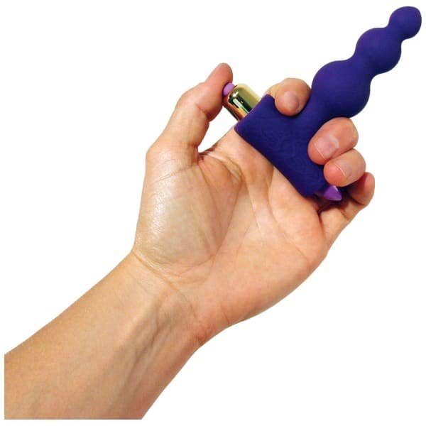 Hand holds dark blue battery-operated anal beads