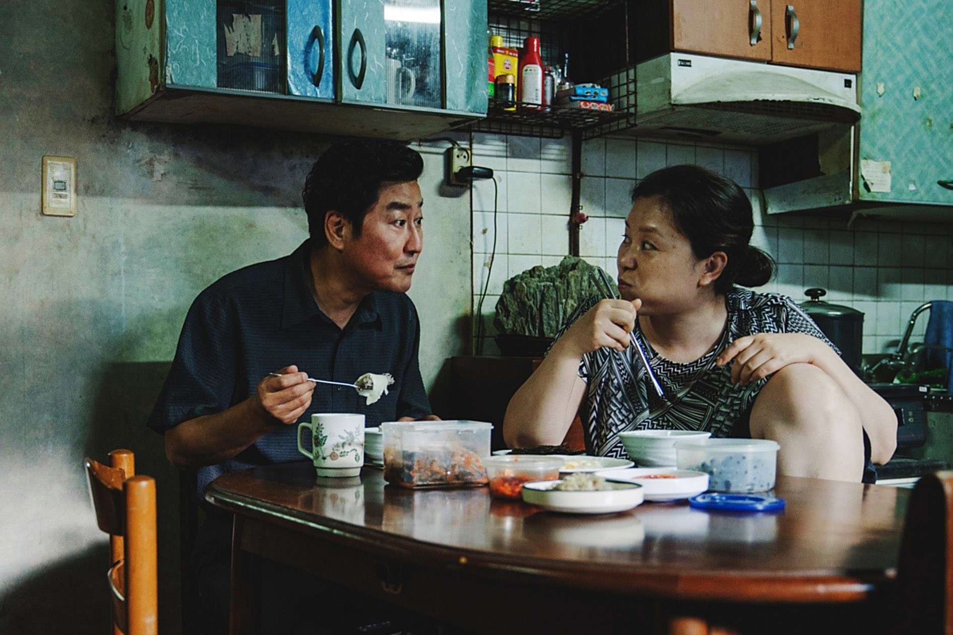Kim Ki-taek and Chung-sook eating at their home