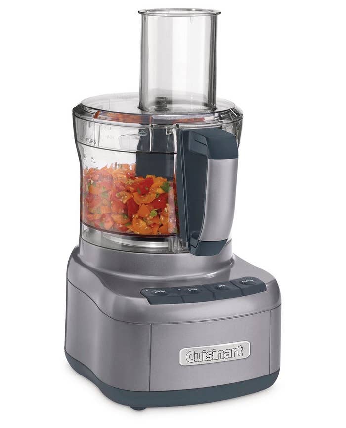 cuisinart food processor with tomatoes chopped up inside