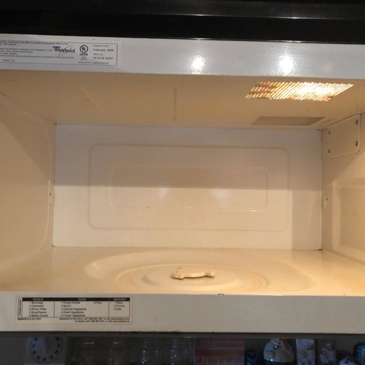 The reviewer's after photo which shows all the spots are gone and the microwave is clean