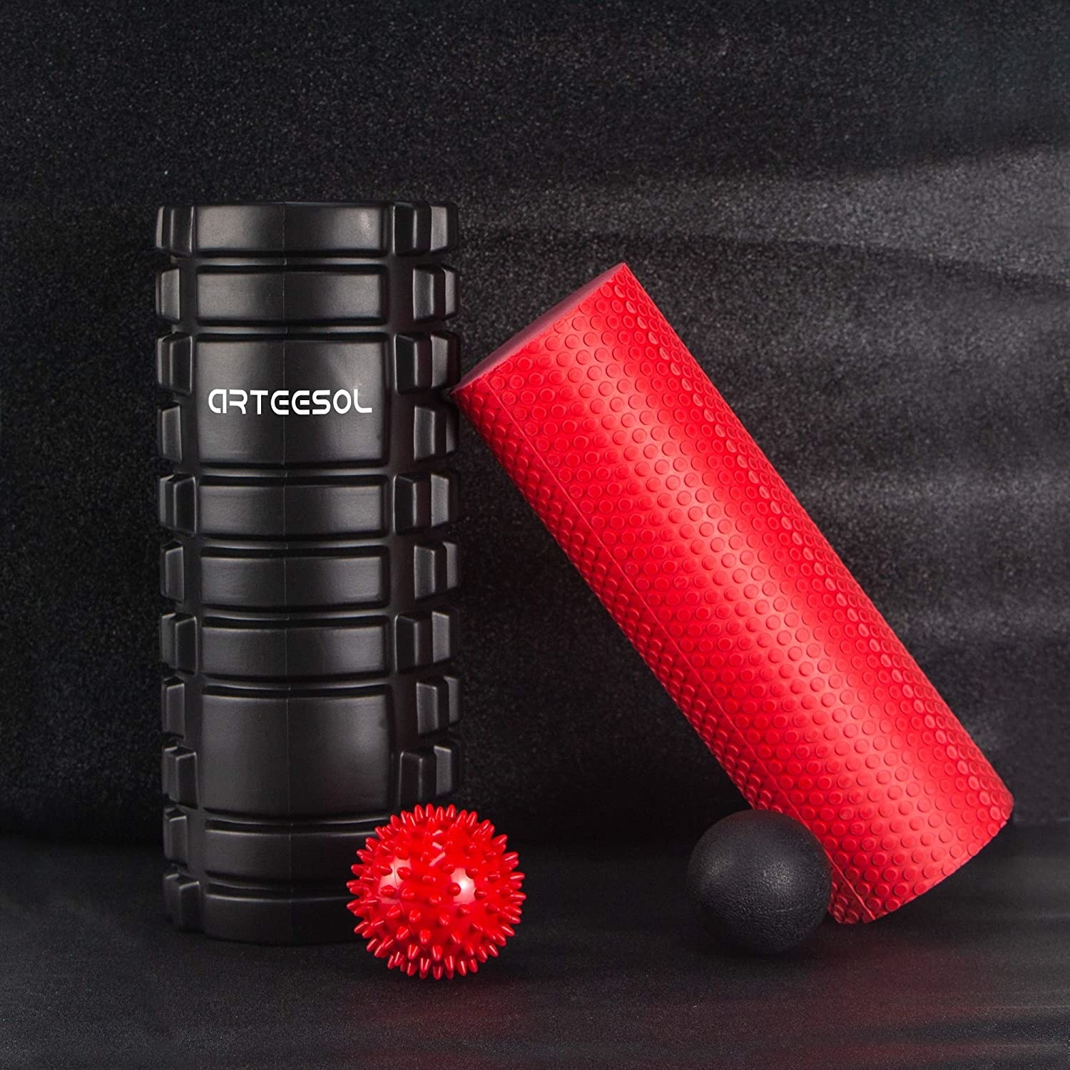 A hard roller, foam roller, spiked massage ball, and a smooth massage ball