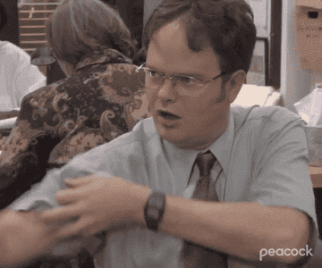 Dwight from The Office kissing his bicep 
