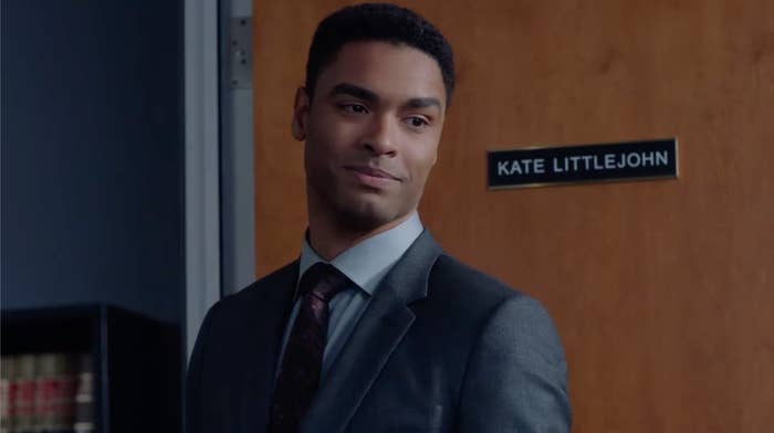 Leonard standing in front of Kate's office