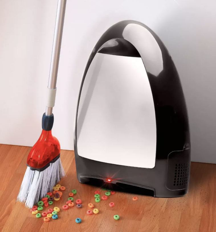 The black touchless vacuum about to suck up Froot Loops