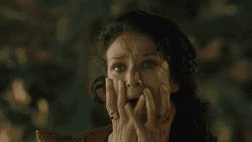 Ellaria Sand in game of thrones screaming and clutching her face in absolute horror