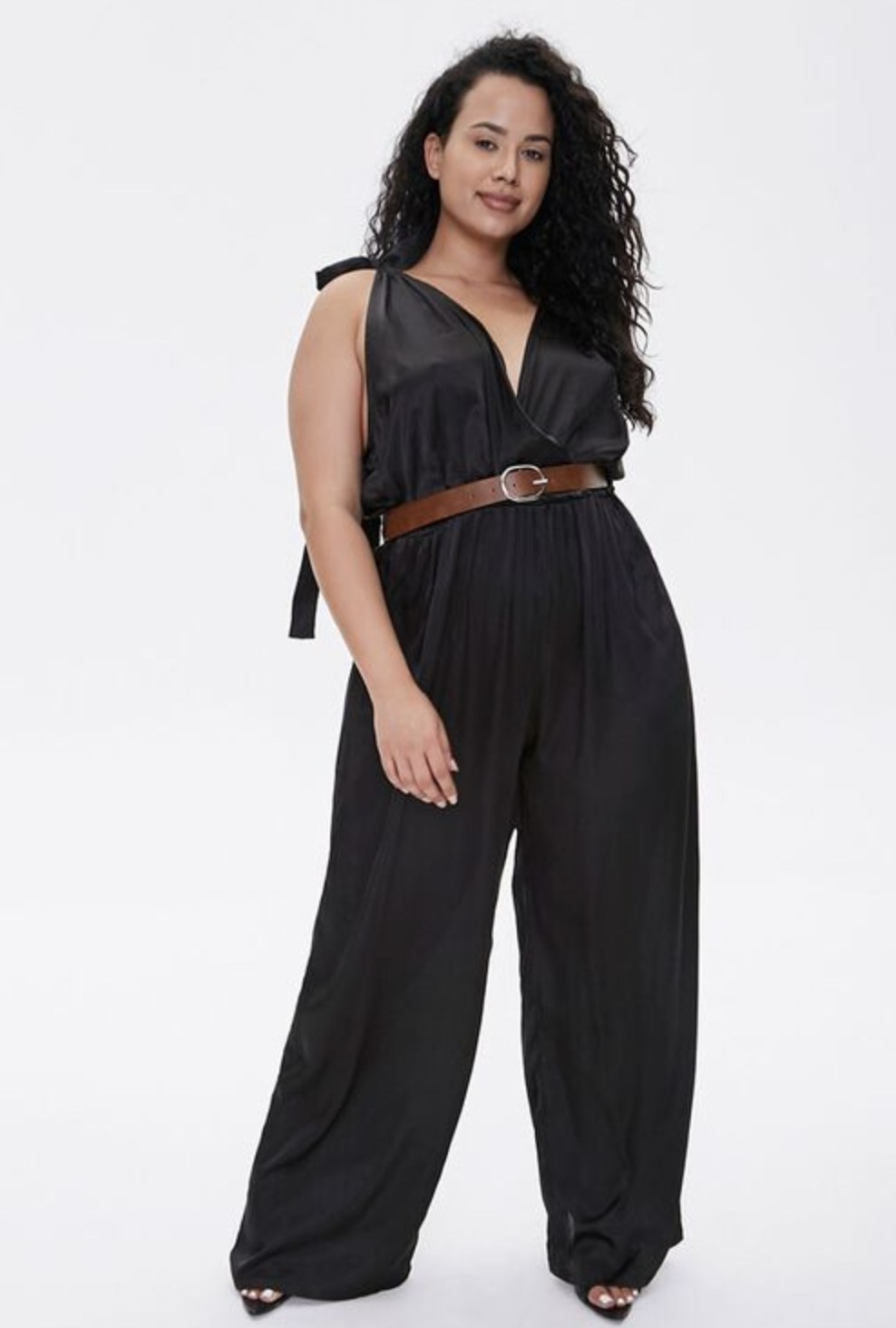 Model is wearing a black jumpsuit