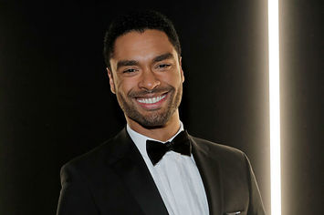 Regé-Jean Page wearing a tux at a red carpet event 