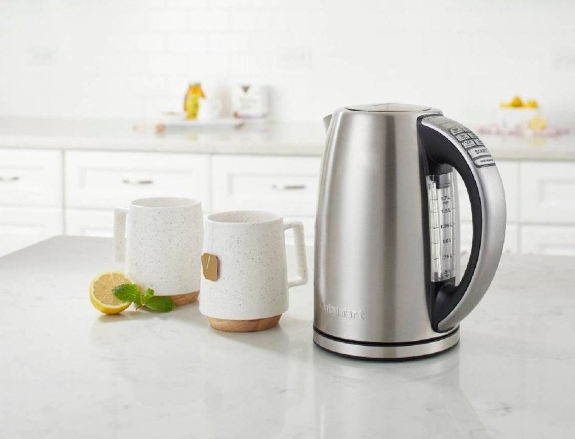 cuisinart tea kettle with tea mugs right next to them