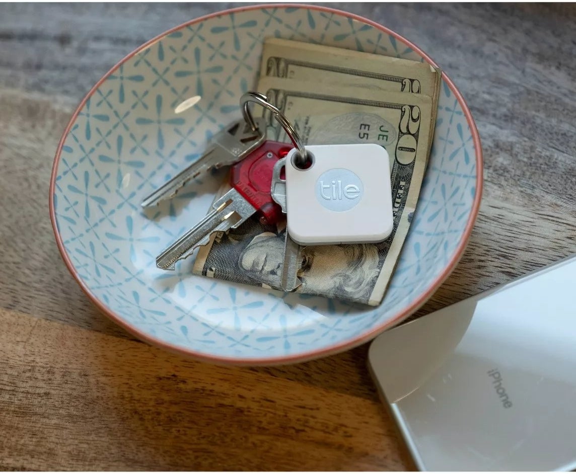 The Tile attached to a set of keys placed inside a bowl