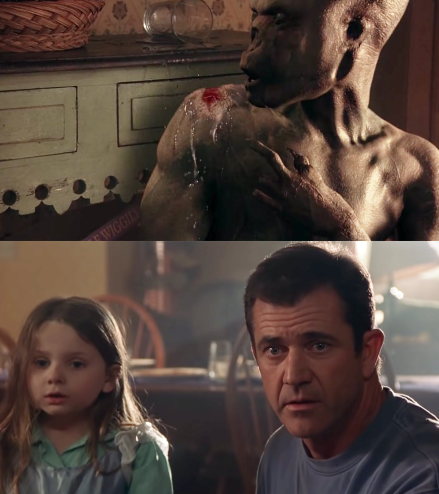 Mel Gibson as Father Graham Hess and Abigail Breslin as Bo Hess in the movie &quot;Signs.&quot;