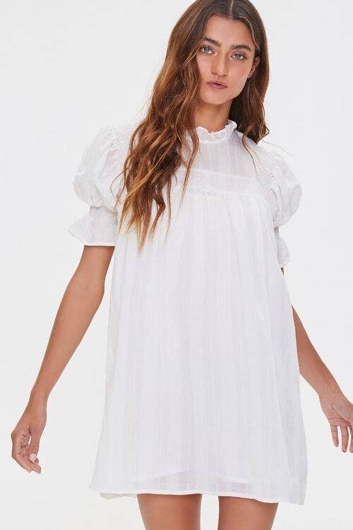 Model in white ruffle puff sleeve dress