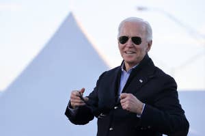 Biden wears aviators and puts on a mask that reads "vote"