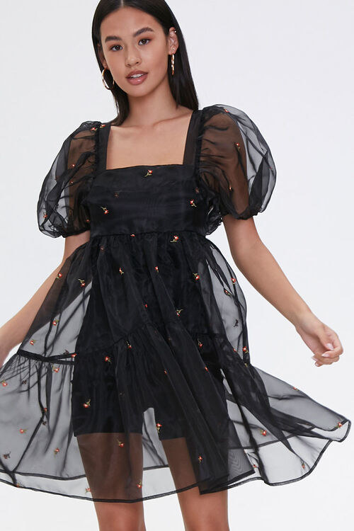 Model in black sheer floral embroidered dress