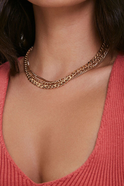 Model in gold layered chain necklace