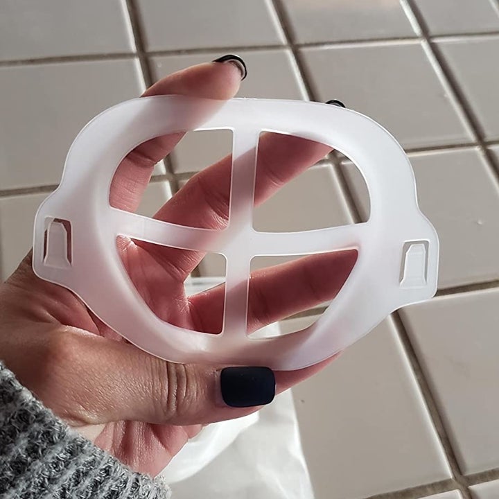Amazon reviewer holding silicone face mask bracket