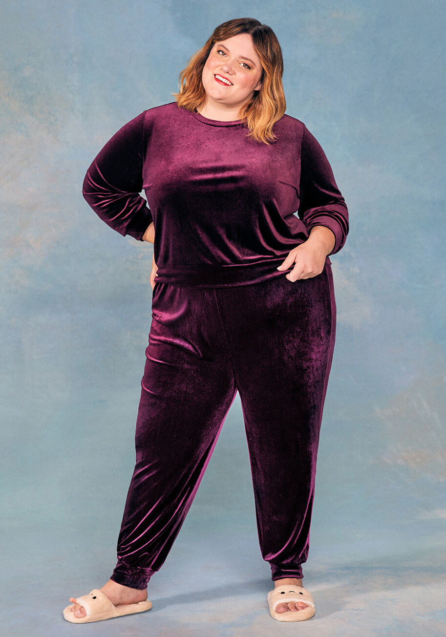 Model wears the burgundy velour pullover with matching pants