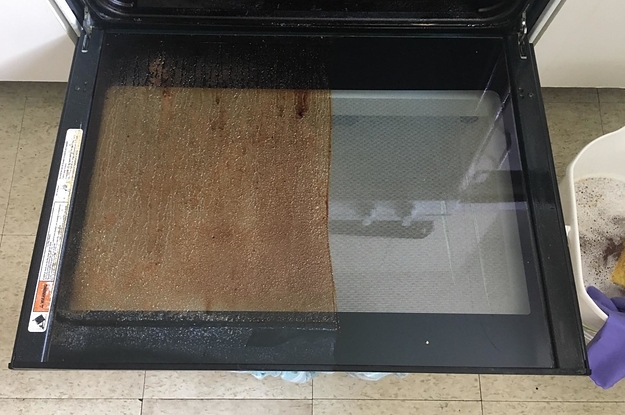 reviewer photo showing oven door revealing caked on grime on one half of it and a clean surface on the other half