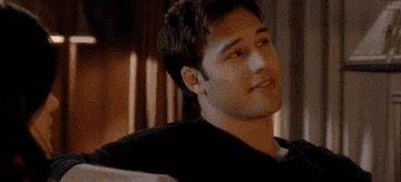 Jake looking at Aria and smiling