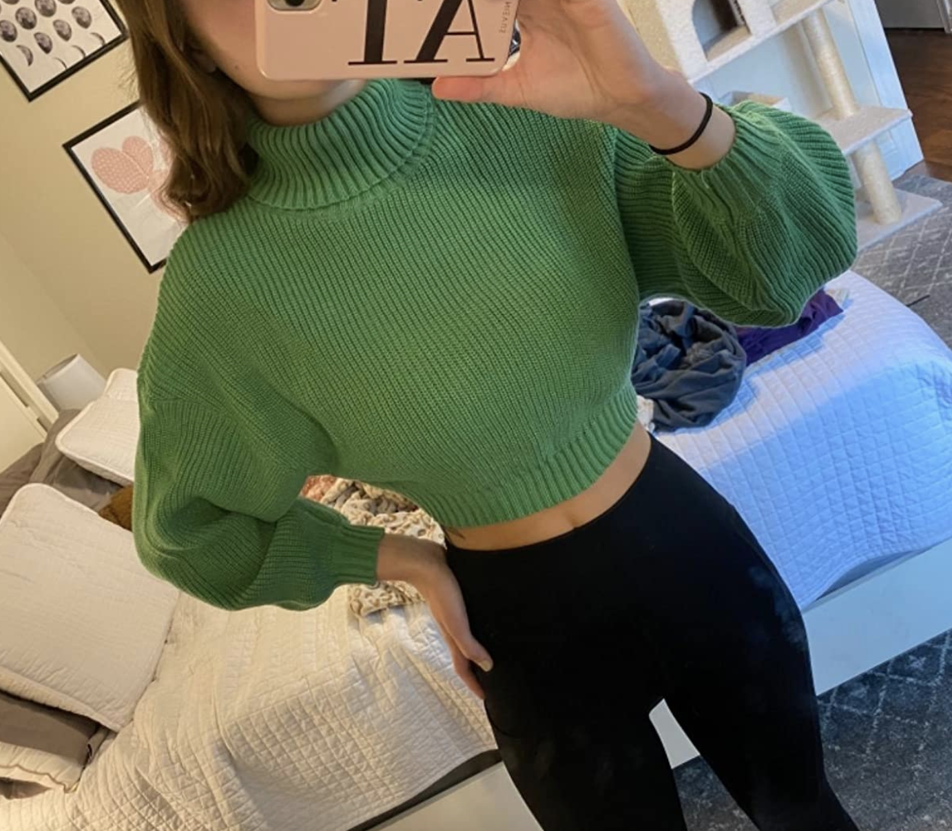reviewer wearing the cropped green sweater